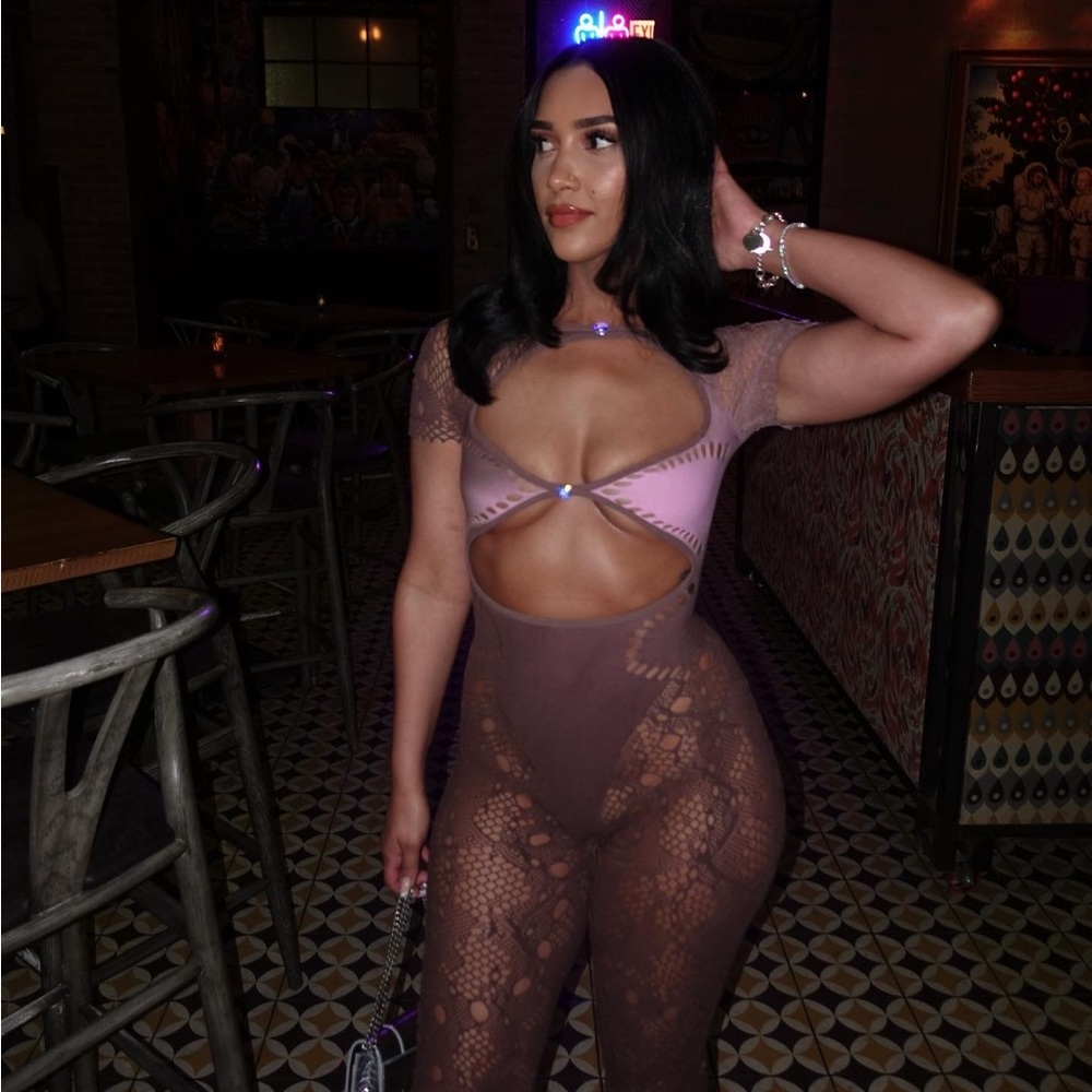 Poster girl jumpsuit color is a brown taupe, pink.